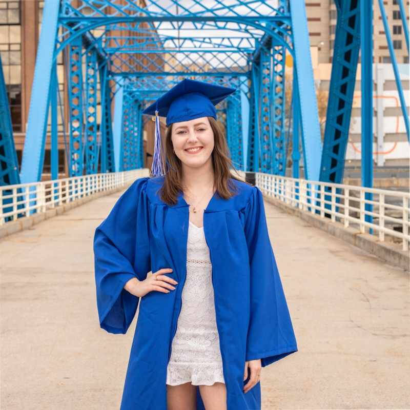 Ally posing after graduation